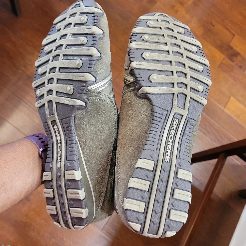Skechers green outlined with gold ad gray. Slip on.
